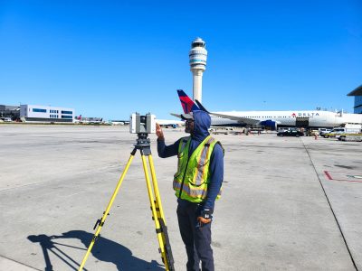 Anthony Operating Scanner on Tarmac